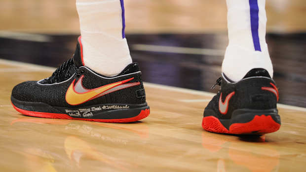 Black and red Nike LeBron shoes.
